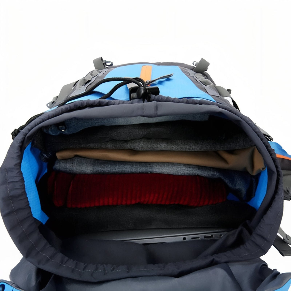 Open drawcord top of the backpack showing clothes packed in the main compartment