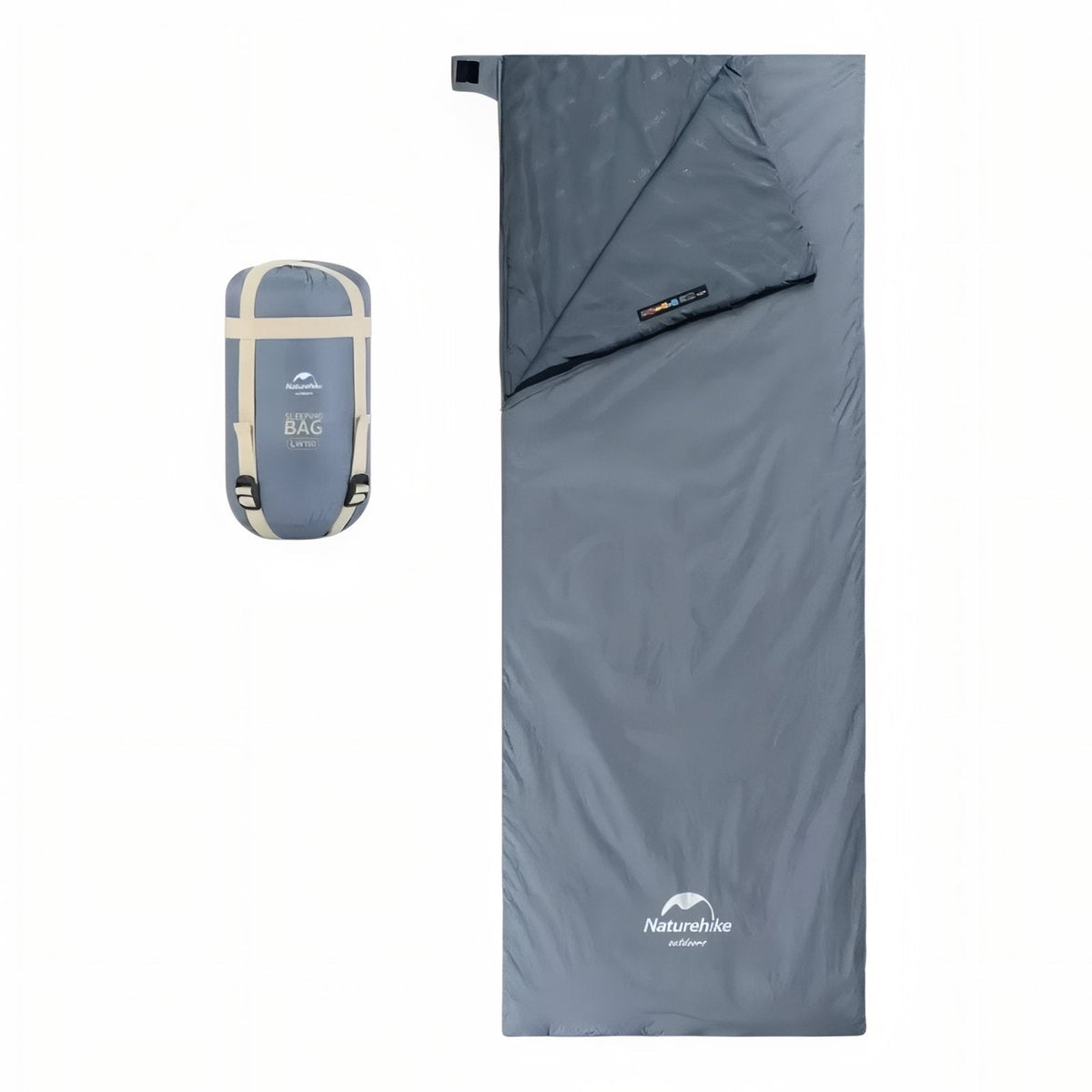 Grey-blue envelope sleeping bag laid flat with the head flap folded back, beside its packed compression sack
