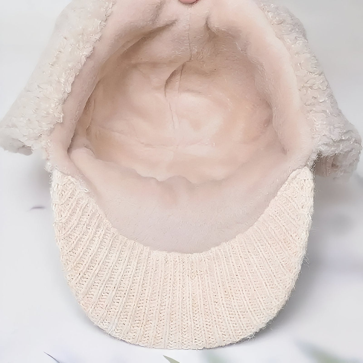 Inside of the trapper hat showing its soft plush lining