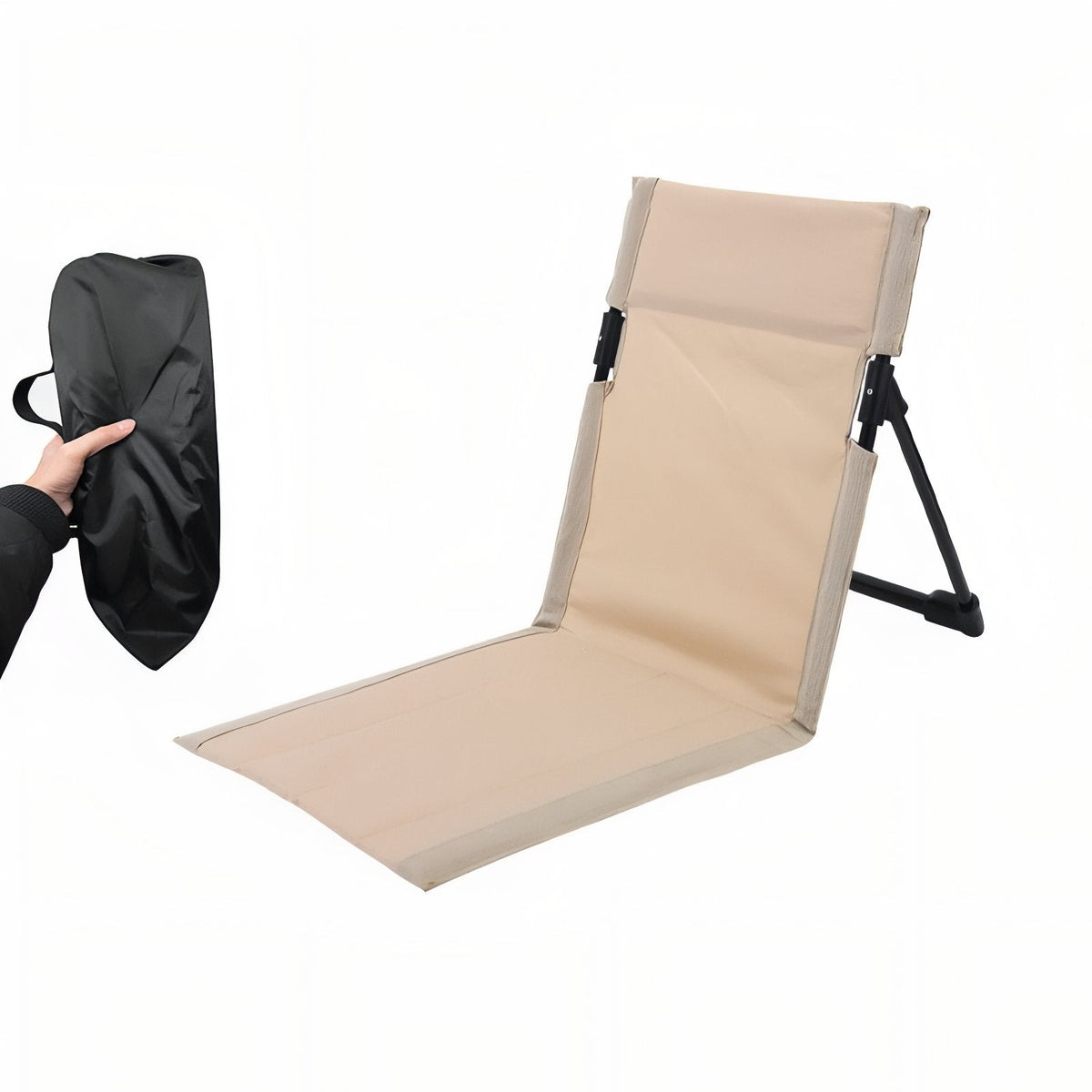 Light beige folding ground chair set up, beside its black storage bag