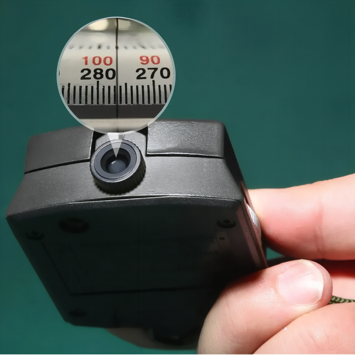 Close-up of the sighting lens magnifying the degree scale