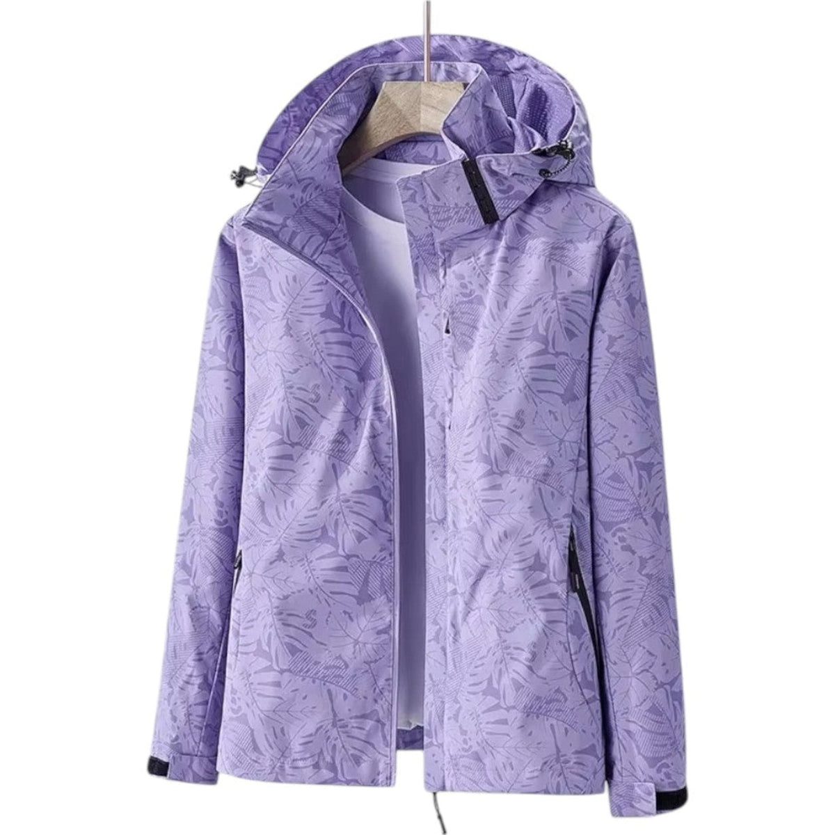 Lilac leaf-print hooded hiking jacket hanging open on a wooden hanger