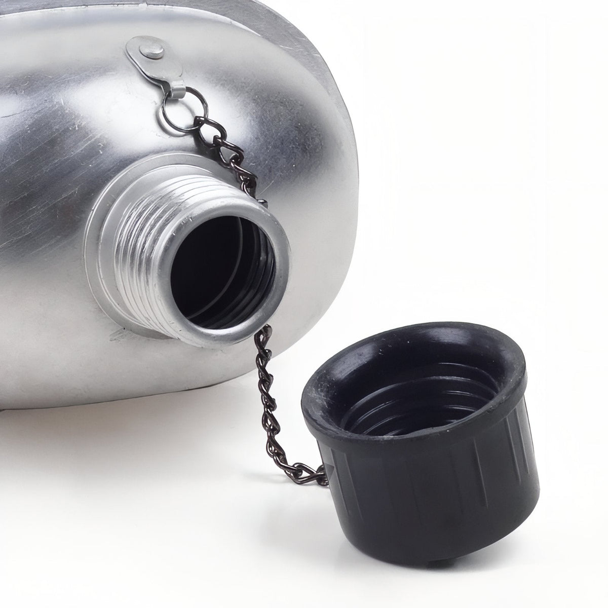 Close-up of the black screw cap hanging from its chain