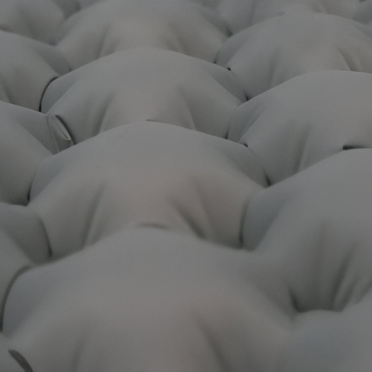 Close-up of the rounded air cells on the grey mat