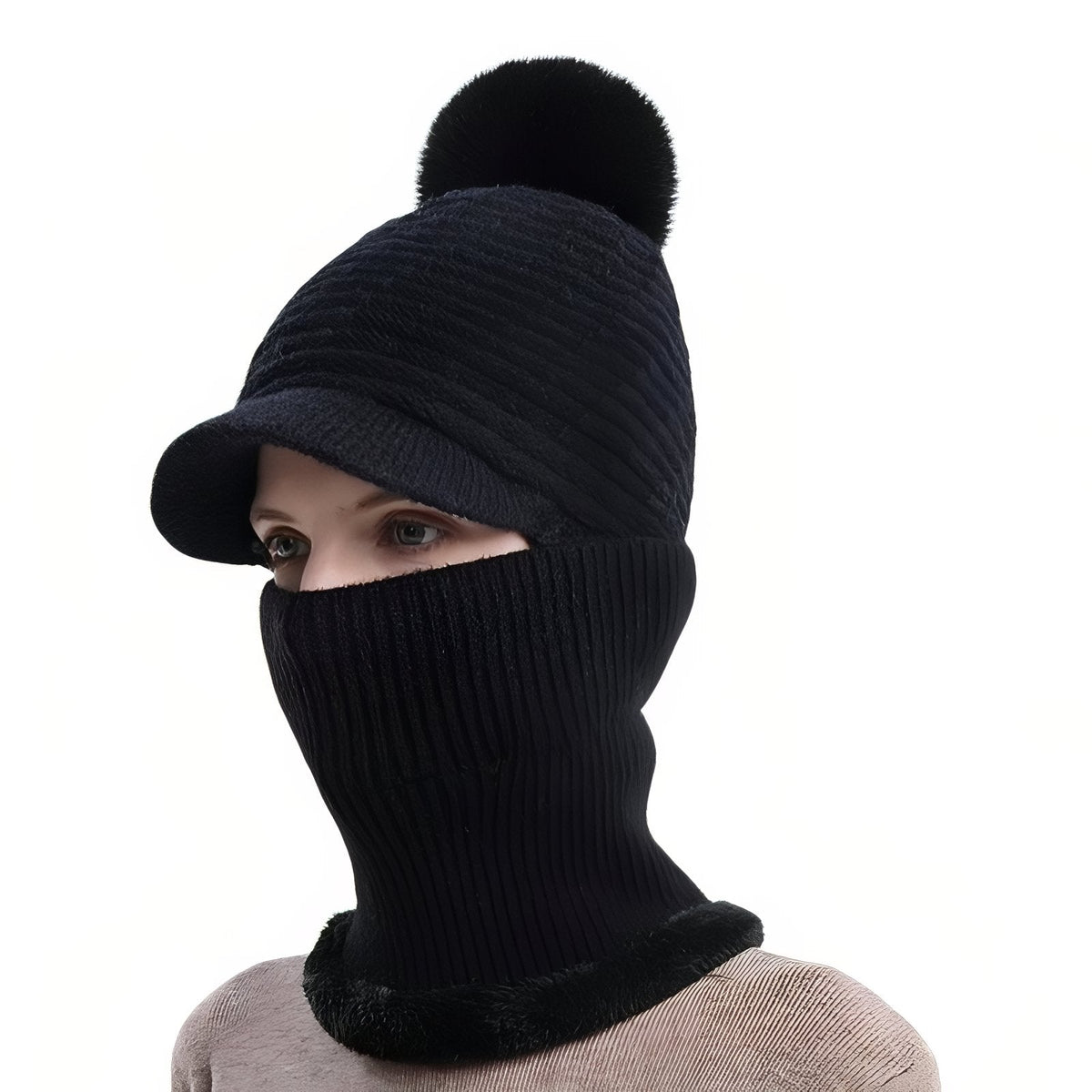 Black brim beanie with a black pompom and the neck warmer pulled up over the face