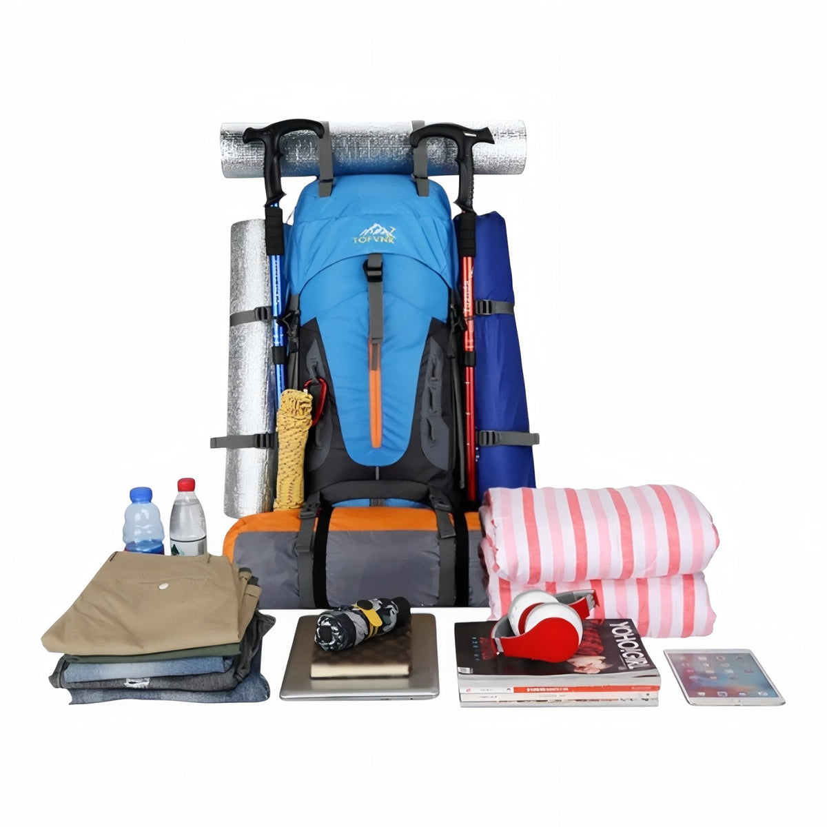 Sky blue backpack loaded with a mat and poles, with clothes, bottles and a book it holds laid out in front