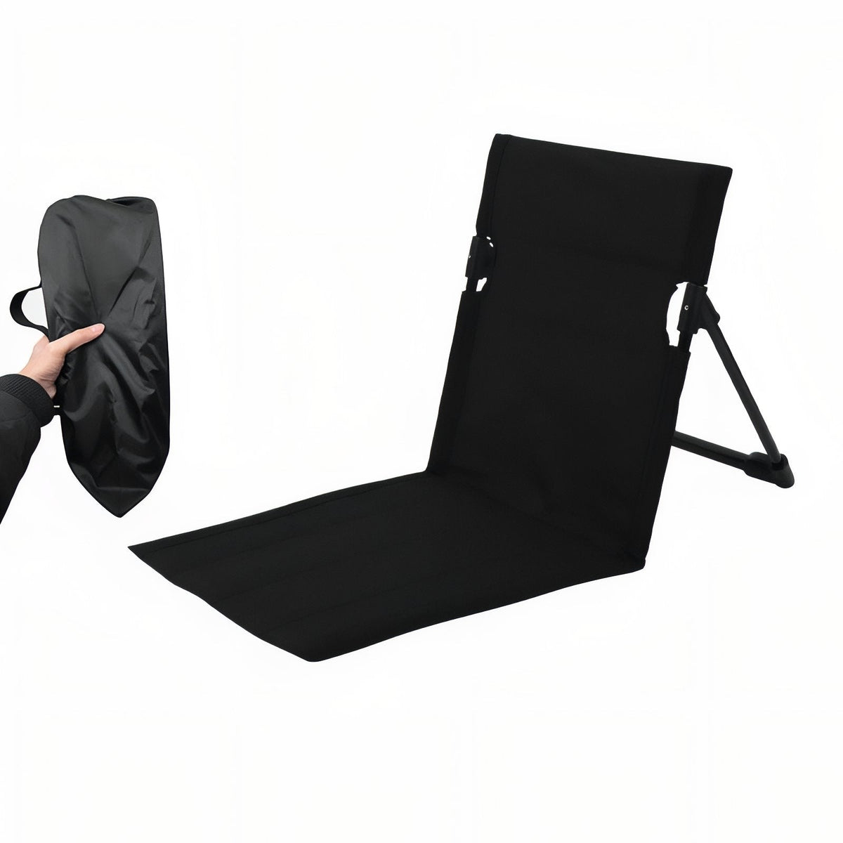 Black folding ground chair set up, beside its black storage bag