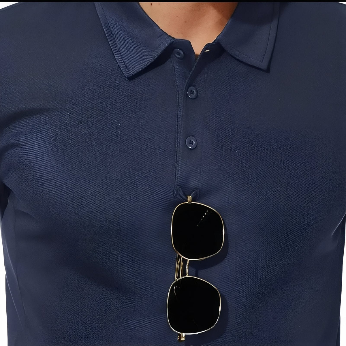 Navy polo worn with sunglasses hooked on the placket