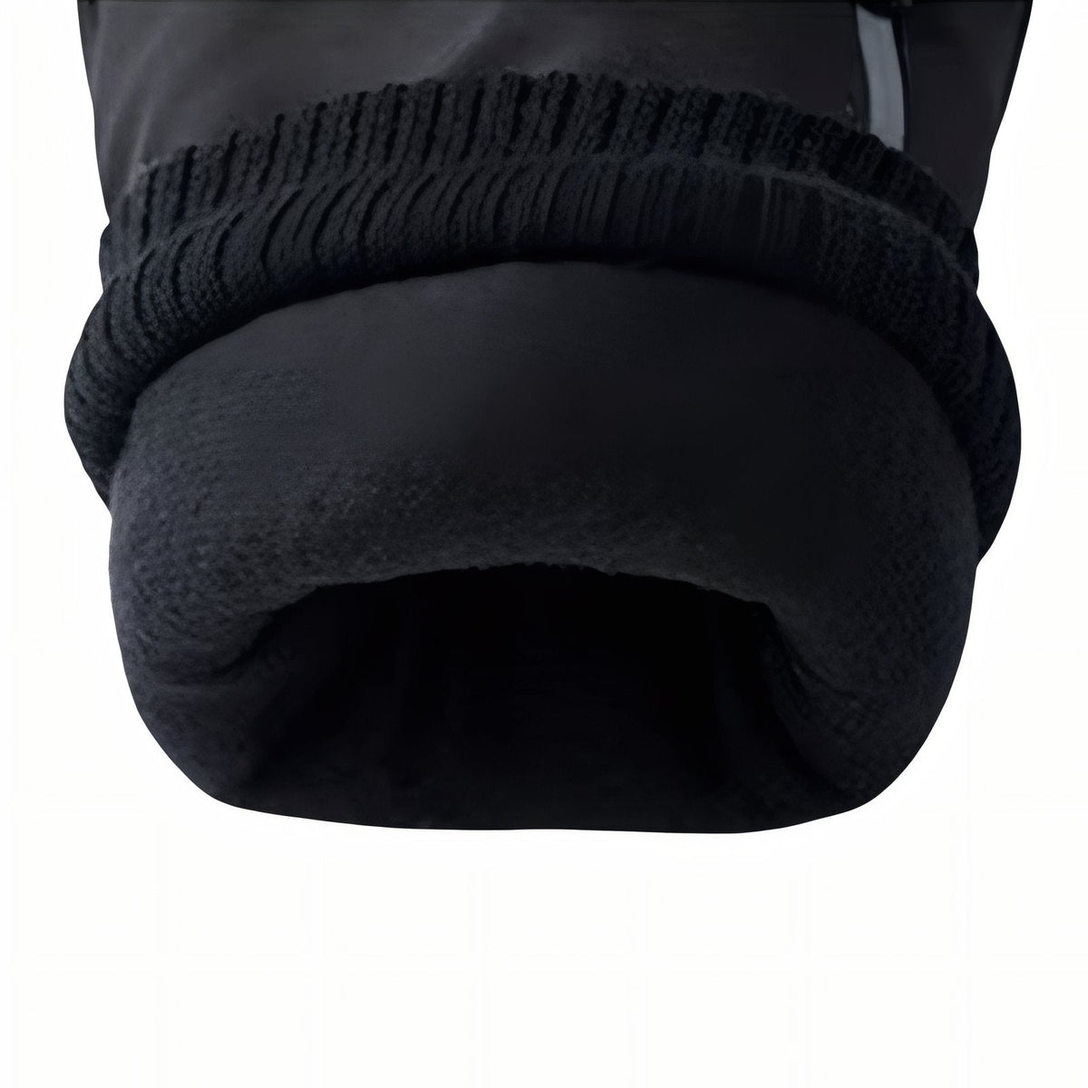 Close-up of the knitted inner cuff and soft black fleece lining of a winter hiking glove