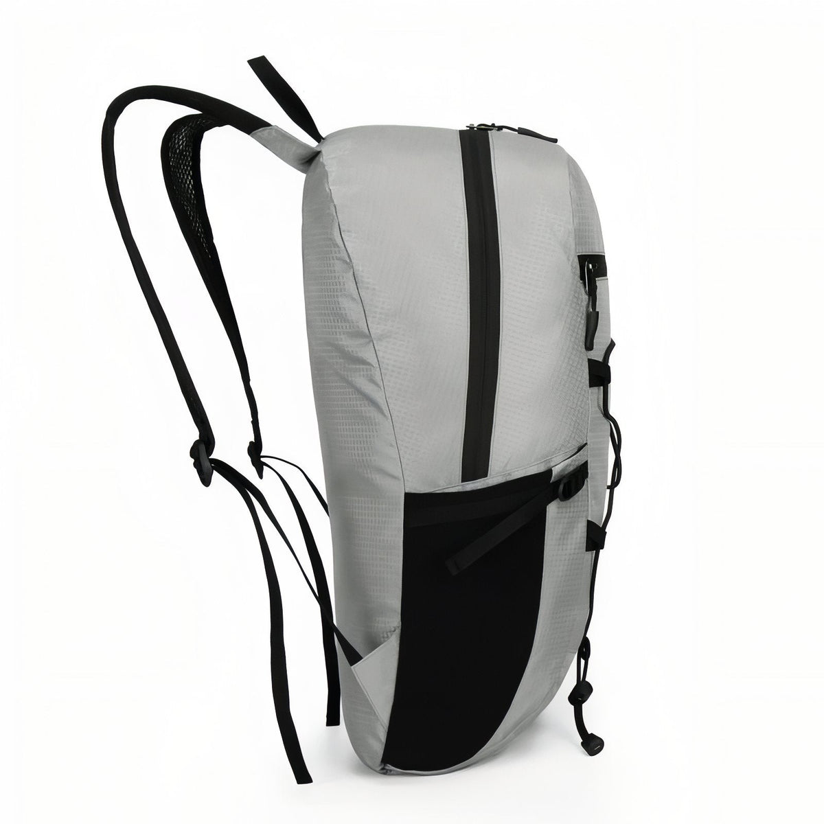 Side view of the light grey daypack showing the black mesh side pocket and the mesh shoulder straps