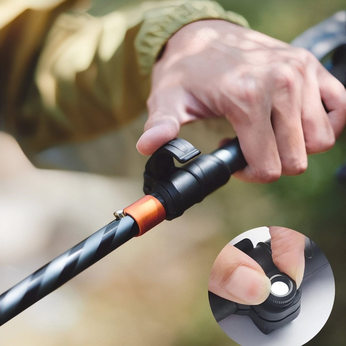 Hand closing the flick lock on the carbon shaft, with a close-up of the push button