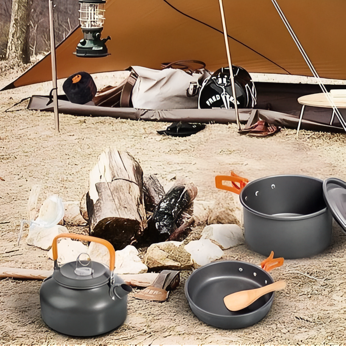 Kettle, pot and pan beside a campfire at a campsite