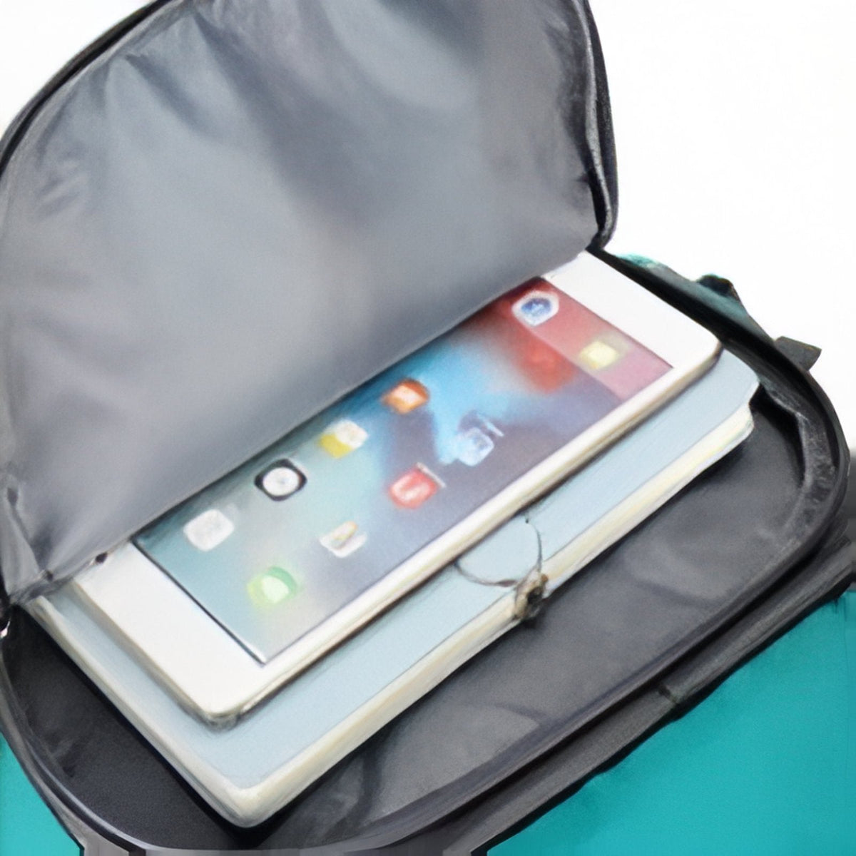 Laptop sleeve inside the main compartment holding a tablet
