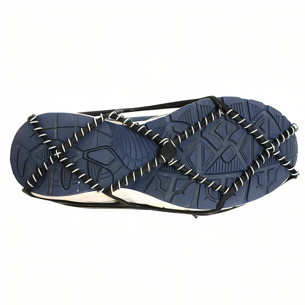 Underside of a shoe with the ice grip's steel coil cords crossing the sole