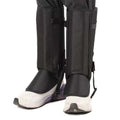 Black hiking gaiters worn over white trail shoes, front view