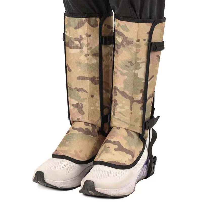 Camouflage print hiking gaiters worn over white trail shoes, front view